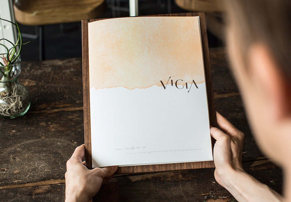 Diner holding Vicia menu