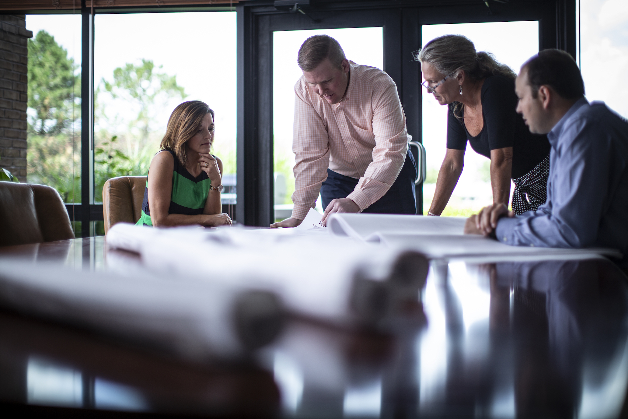 Employees around conference table