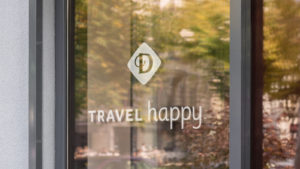 Drury Hotels vinyl sign - "Travel Happy" tagline