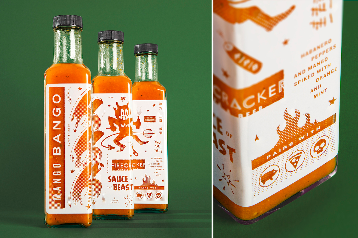 Photograph of Firecracker's orange hot sauce bottles